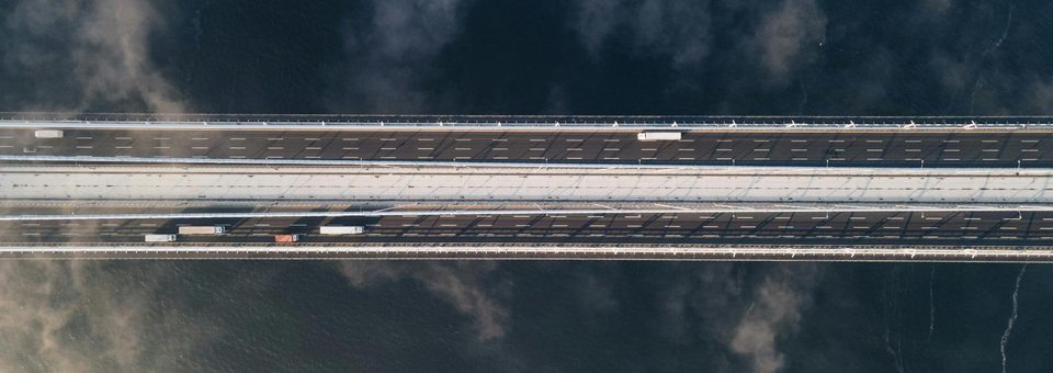 Aerial view of an elevated highway crossing open water