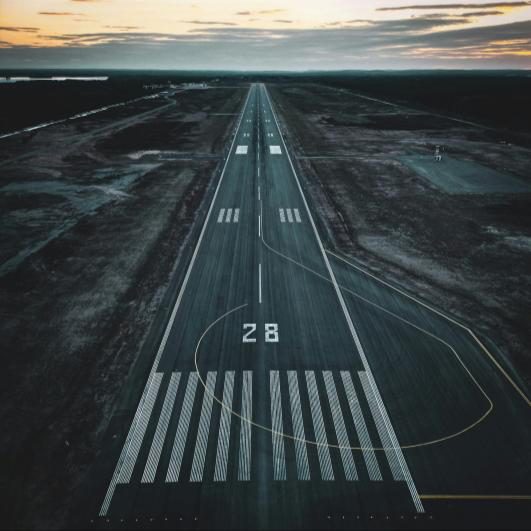 Airport runway threshold at dusk